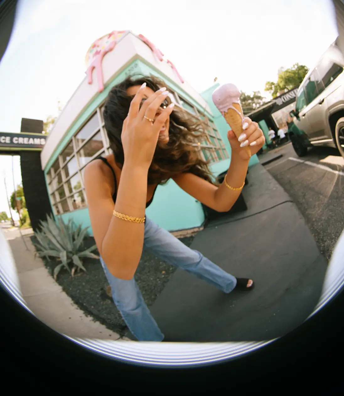 a woman holding an ice cream cone
