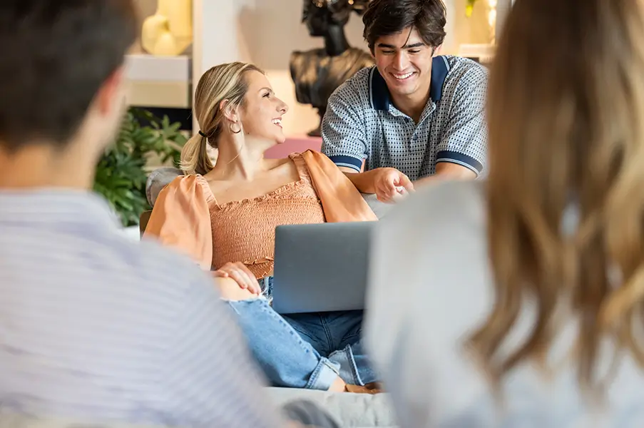 friends looking at a laptop